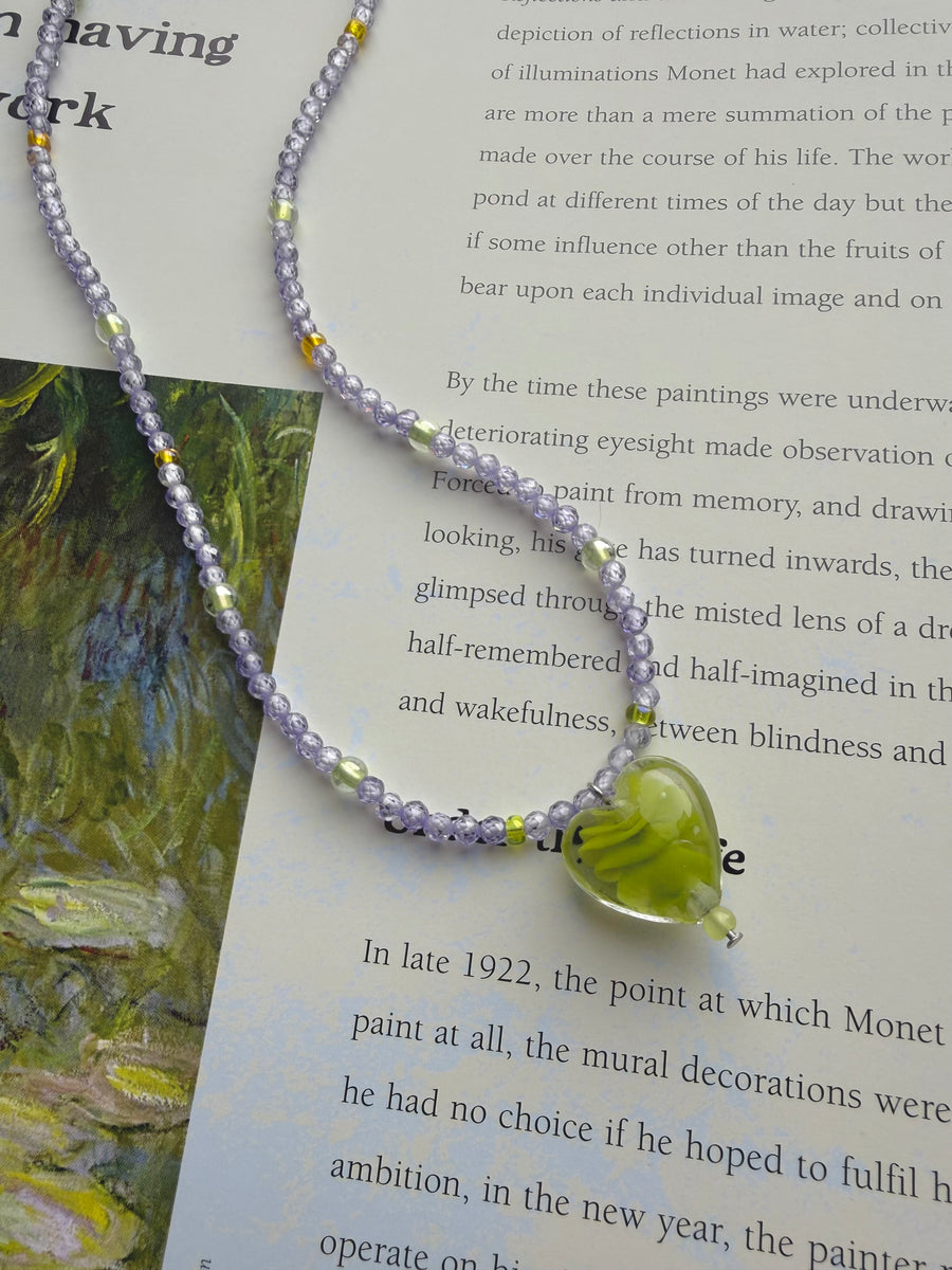 Green Swirl Heart Necklace with a soft green glass heart pendant
