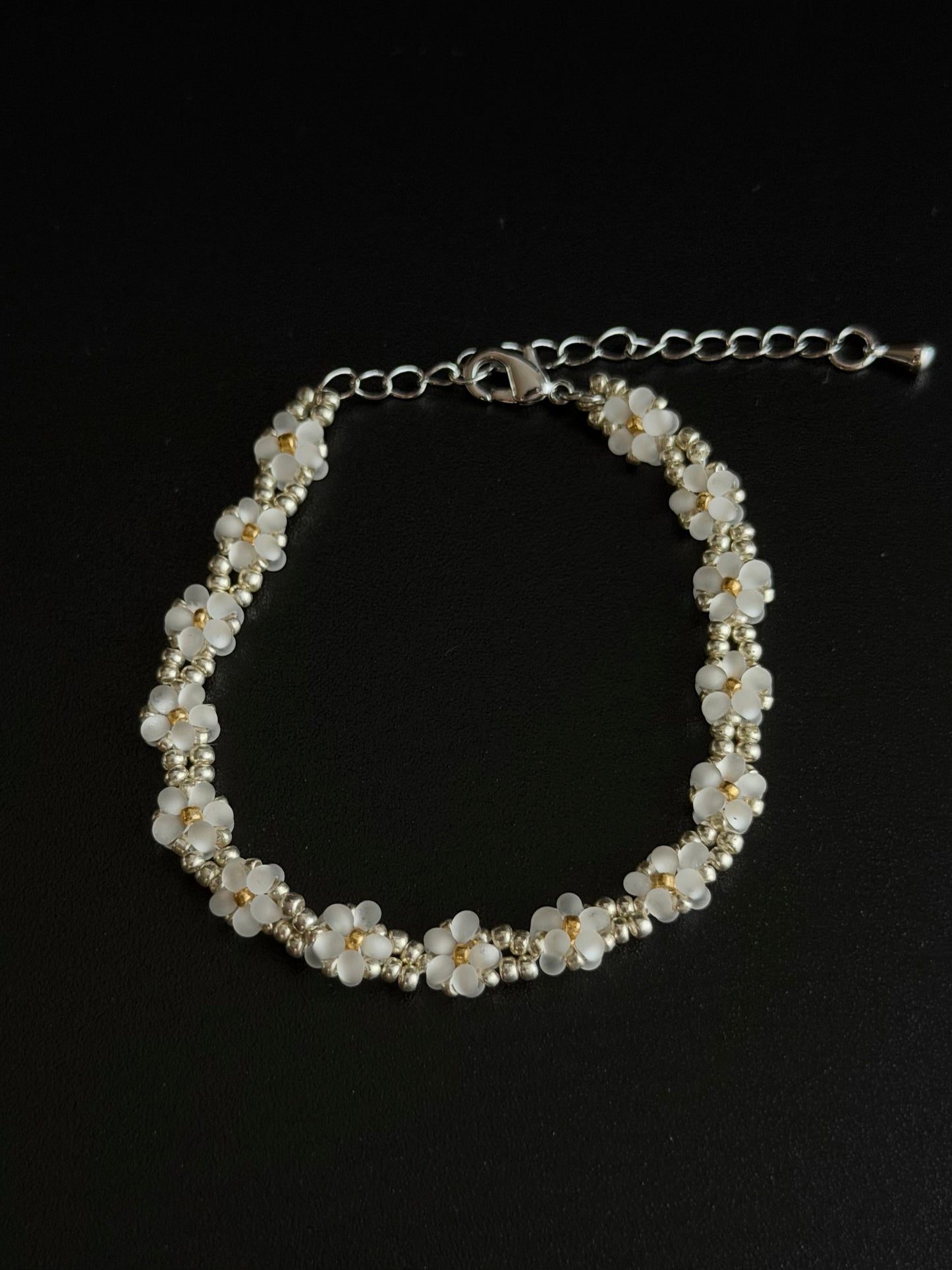 Daisy Bead Bracelet flat product image on dark background
