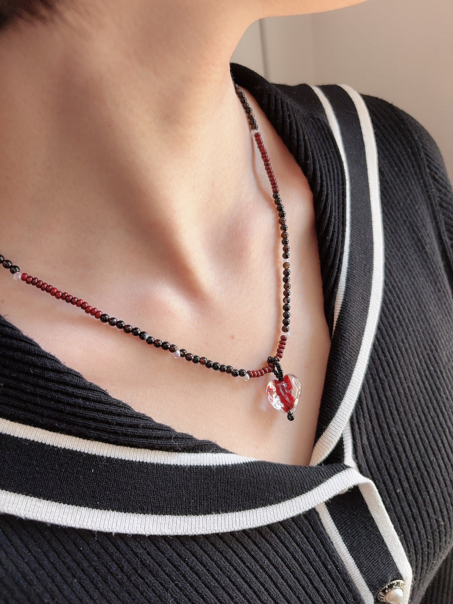 Red Glass Heart Necklace worn close to the collarbone